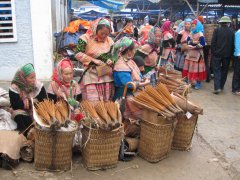 15-Flower Hmong woman selling incense sticks